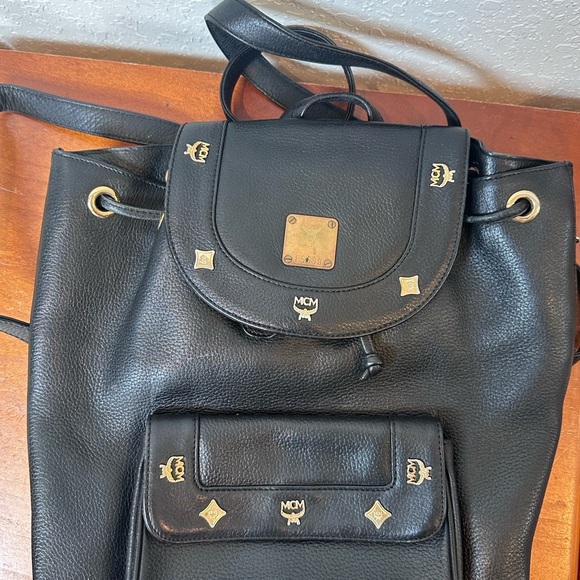 MCM Handbags - MCM Black Leather Drawstring Shoulder Backpack with Gold Accents